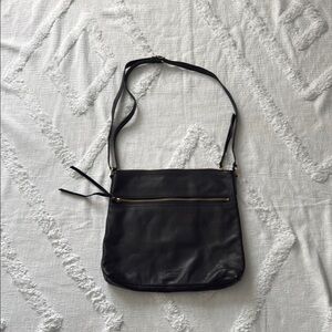 Margot's black handbag